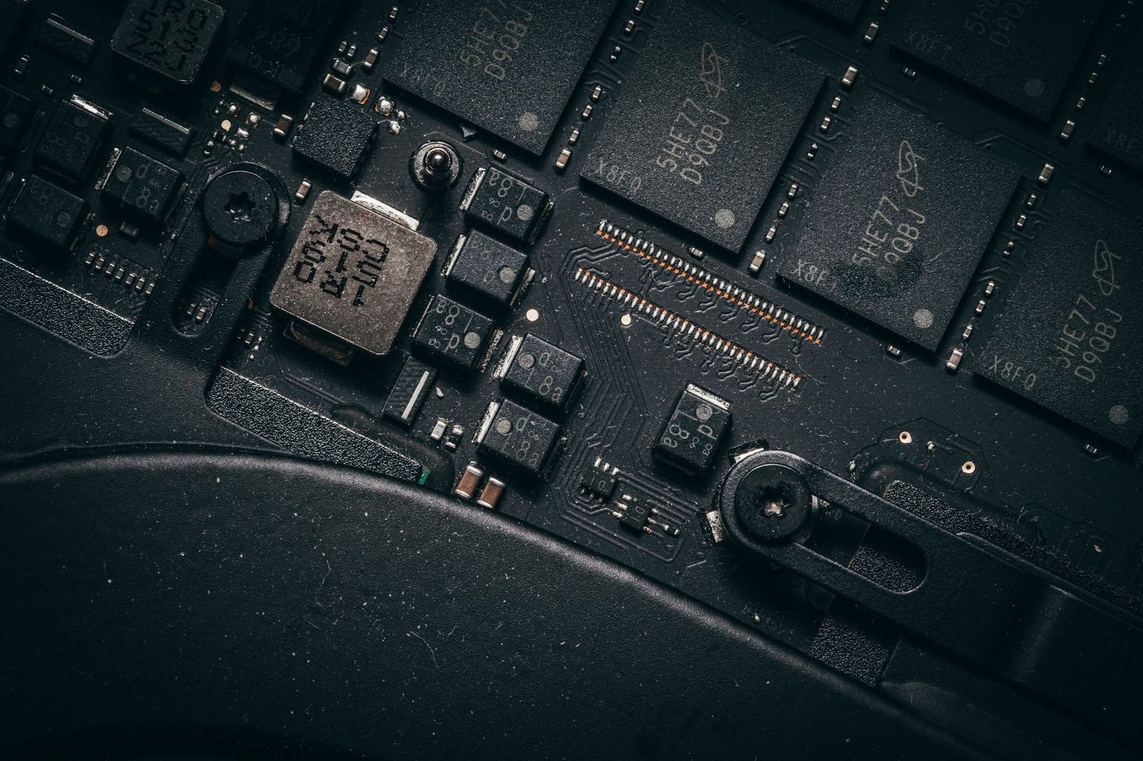 Detailed macro shot of electronic circuit board showing microchips and components.